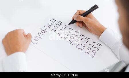 business man making notes on a piece of paper. Stock Photo