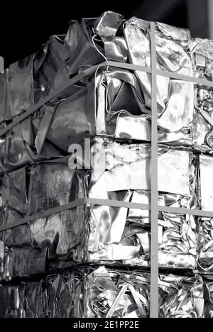 unpainted aluminum scraps pressed in cubes, black and white photography Stock Photo