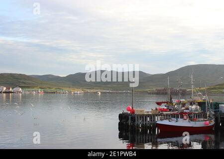 fishing boats parked on the water of Norwegian villages Stock Photo