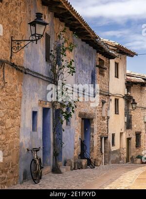 bicycle leaning on a wall in Valderrobres, Teruel Stock Photo