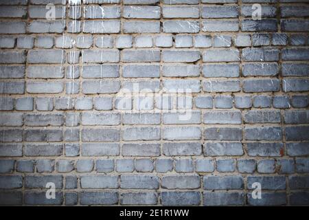 Paint streaks on the brick wall. Stock Photo