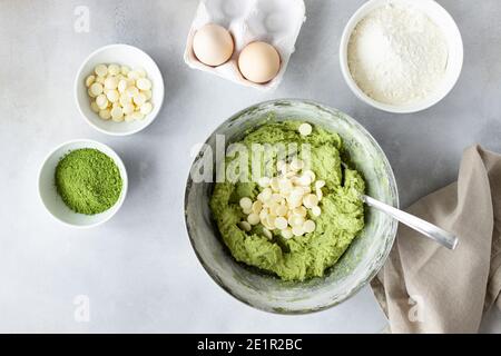 Flat lay composition with green tea matcha dough, white chocolate chips Stock Photo