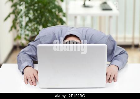 Close-up of a businessman using a laptop in an office high quality photo Stock Photo
