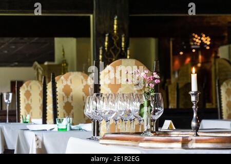 Glasses on an elegantly set table in a dignified dining room Stock Photo