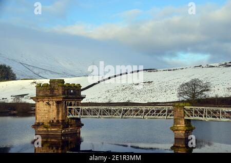 The Castellated Tower Value House on Lower Ogden Reservoir Dam near the Village of Barley from Path to Pendle Hill in Ogden Clough, Lancashire. UK. Stock Photo