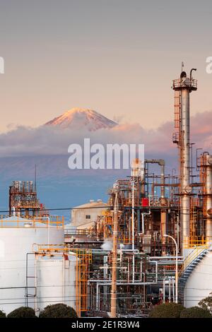 Mt. Fuji, Japan as viewed from behind factories at dusk. Stock Photo