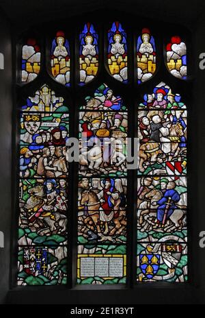 A stained glass window by F. H. Spear (1902 - 1979) depicting scenes from The Canterbury Tales, Church of St Andrew, Holt, Norfolk Stock Photo