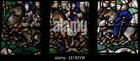 A stained glass window by F. H. Spear (1902 - 1979) depicting scenes from The Canterbury Tales, Church of St Andrew, Holt, Norfolk Stock Photo