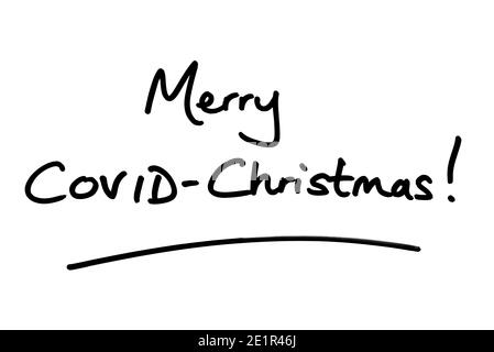 Merry COVID-Christmas! handwritten on a white background. Stock Photo