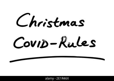 Christmas COVID-Rules handwritten on a white background. Stock Photo