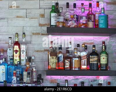 Many bottles of alcohol in a bar to create drinks Stock Photo