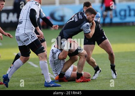 NEWCASTLE UPON TYNE, ENGLAND. JAN 9TH    Mark Wilson of Newcastle Falcons is tackled during the Gallagher Premiership match between Newcastle Falcons and Gloucester Rugby at Kingston Park, Newcastle on Saturday 9th January 2021. (Credit: Chris Lishman | MI News) Stock Photo