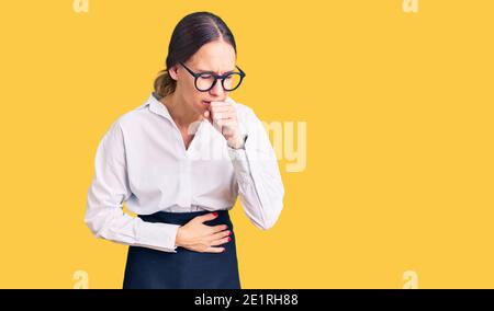 Beautiful brunette young woman wearing professional waitress apron feeling unwell and coughing as symptom for cold or bronchitis. health care concept. Stock Photo