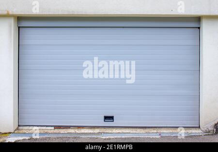 Plastic white garage door - exterior Stock Photo