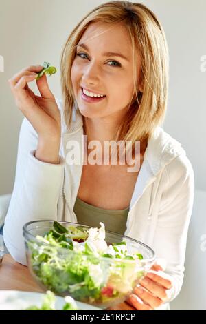 Woman eating salad Stock Photo