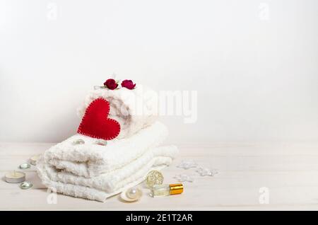 Spa treatment, massage as a gift on Valentine's Day with copy space on a white background. For beauty salons. Stock Photo