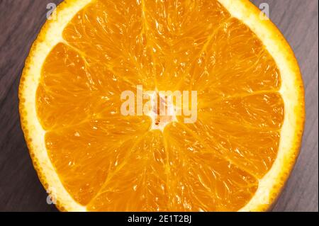 Fresh, jucy, orange on light wooden background. Stock Photo