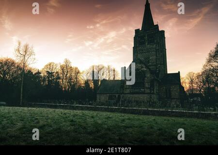 Rural old cemetery church in the evening. Cemetery church in rural sunset. Sunset cemetery church. Old cemetery church Stock Photo