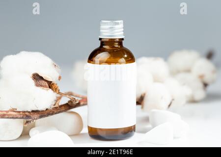 Brown glass bottle with metal cap for natural organic skin care product. White label mock up Stock Photo