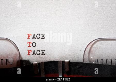 Face to face phrase written with a typewriter. Stock Photo