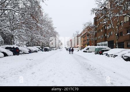 Madrid, Spain. January 09, 2021: Snowstorm, blizzard on streets, cars covered. Snowing in winter. Stock Photo