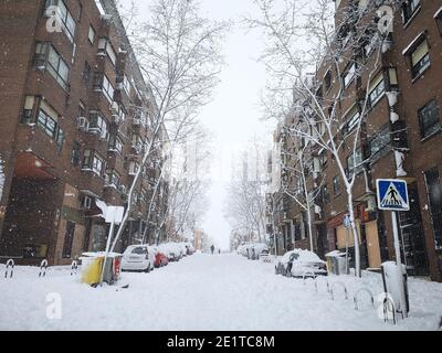 Madrid, Spain. January 09, 2021: Snowstorm, blizzard on streets, cars covered. Snowing in winter. Stock Photo