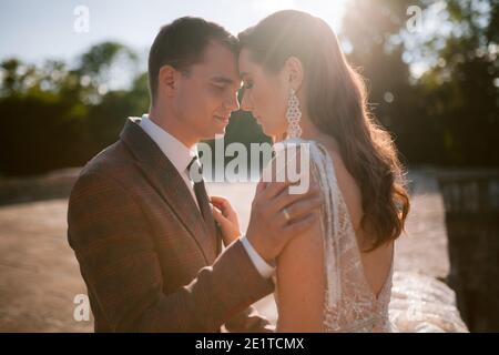 Bride and groom looking at each other and smiling. Happy newlywed Wedding couple Stock Photo