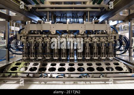 Automatic food packing machine for industrial use. Stock Photo
