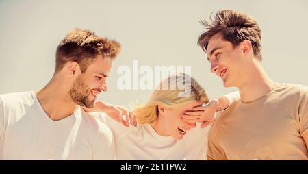 Friendship relations. Friend zone concept. Happy together. Cheerful friends. People outdoors. Happy woman and two men. Member friendship wishes to enter into romantic relationship. Friendship love. Stock Photo