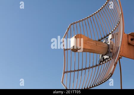 A special openwork antenna used in the telecommunications industry as well as cellular networks and wireless Internet. Technology of digital sending and receiving of data packets. Stock Photo