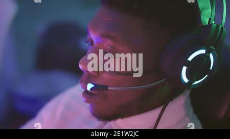 Black man, busiessman with headphones working from home. Online support . High quality photo Stock Photo