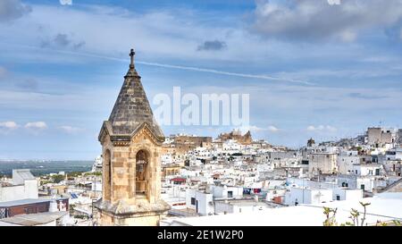 View of the old white town of Ostuni and the cathedral at sunrise. Brindisi, Apulia in southern Italy. Europe. Stock Photo