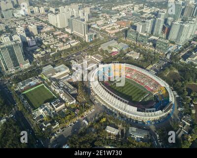 Aerial view of the city skyline with buildings and high rises on a day with light smog in the Dongcheng and Chaoyang district of the Chinese capital city of Beijing, China, PRC. © Time-Snaps Stock Photo