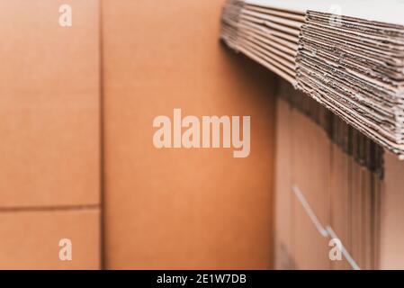 Home moving using corrugated cardboard boxes as protection material, detail. Stock Photo