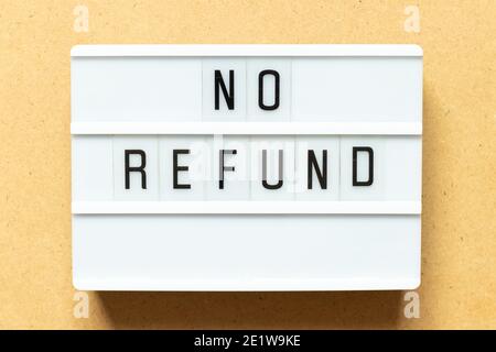 Lightbox with word no refund on wood background Stock Photo