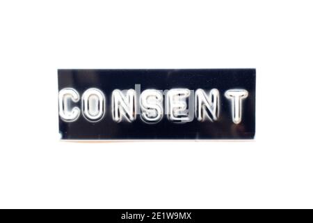 Embossed letter in word consent on black banner with white background Stock Photo