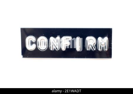 Embossed letter in word confirm on black banner with white background Stock Photo