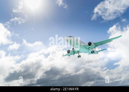 American airplane landing on Princess Juliana International airport on the island of St.maarten. Stock Photo