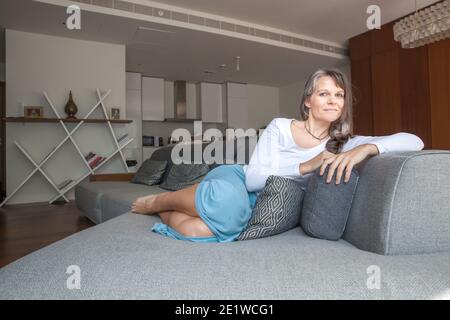 Grandma happy with her new computer as she is using to connect with her nephews Stock Photo