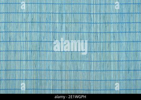Top view. Full frame of blue bamboo food mat isolated on white background. Traditional kitchen utensils. Stock Photo