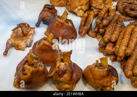 Smoked meat products on a shelf in a store Stock Photo