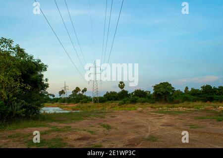 Electric power transmission is the bulk movement of electrical energy from a generating site, such as a power plant, to an electrical substation. Stock Photo