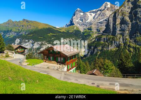 Famous mountain resort with old wooden houses and high mountains in background, Murren, Bernese Oberland, Switzerland, Europe Stock Photo