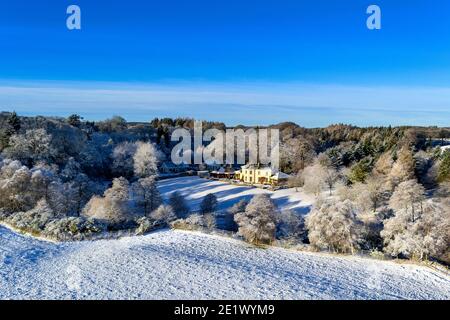 DIVIE OR EDINKILLIE RAILWAY VIADUCT MORAY SCOTLAND VIEW FROM VIADUCT TO SNOW COVERED  HOUSES THE EDINKILLIE CHURCH AND FROST COVERED TREES Stock Photo