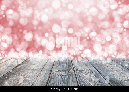 Empty rustic wooden table with blurred lights over red background. Can be used to mount or showcase your products Stock Photo