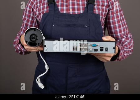 Close up picture of electricians hands holding surveillance camera kit Stock Photo