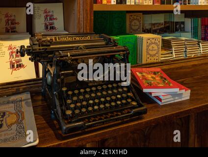 A picture of an old typewritter inside a bookstore. Stock Photo