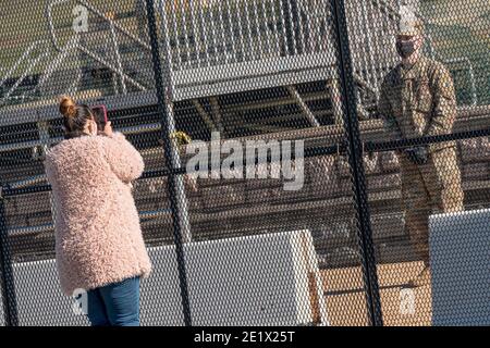 Members of the U.S. National Guard speak with onlookers as they pass the newly gated U.S. Capitol. The capitol has been off-limits to the public since Wednesday, January 6th, after Trump supporters stormed the premesis. (Kit Karzen Photo - 11/9/2020) Washington, DC, USA, on January 09, 2021. Photo by Kit Karzen/ABACAPRESS.COM