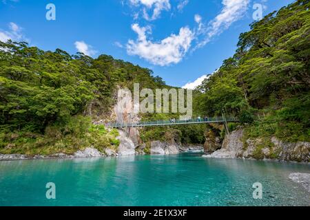 Suspension bridge at Blue Pools rock pools, Makarora River, turquoise crystal clear water, Haast Pass, West Coast, South Island, New Zealand Stock Photo
