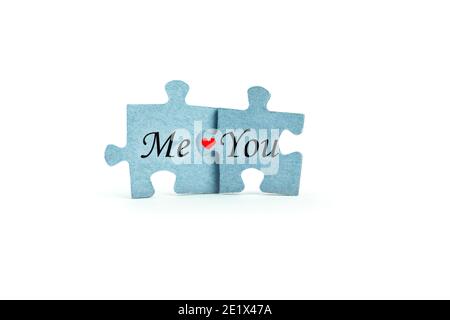Two puzzles isolated on white background - Me and You. Stock Photo